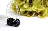 Black beaded hoop earrings--every girl needs a pair of black earrings they can count on all year long! This pair features sterling silver hoops and handmade glass beads in black with subtle swirls of gray. See them up close here https://wrist-flair.myshopify.com/collections/beaded-earrings/products/black-beaded-sterling-silver-hoop-earrings