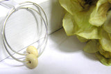 Cream neutral colored earrings you can rely on all year long! See this pair up close by visiting https://wrist-flair.myshopify.com/collections/beaded-earrings/products/beige-beaded-sterling-silver-hoop-earrings