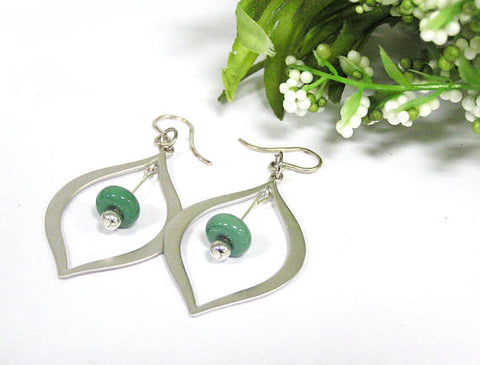 Green Teardrop Earrings--gorgeous, modern and perfect for spring fashion 2019! See them up close here https://wrist-flair.myshopify.com/collections/beaded-earrings/products/green-beaded-silver-teardrop-earrings
