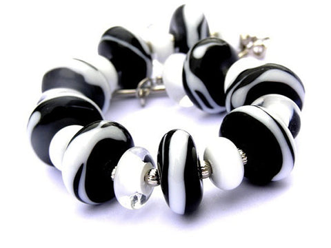 Black and White Zebra Print Bracelet--gorgeous handmade beads in a zebra print. Animal inspired and a little on the wild side! See it up close here https://wrist-flair.myshopify.com/collections/statement-bracelets/products/black-and-white-zebra-toggle-bracelet