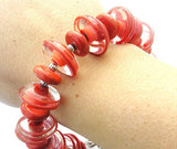 Coral Glass Beaded Bracelet--a stylish way to incorporate the 2019 Pantone Color Of The Year into your own wardrobe! See it up close here https://wrist-flair.myshopify.com/collections/statement-bracelets/products/coral-statement-bracelet