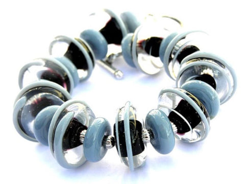 Black And Gray Beaded Statement Bracelet--neutral in color and classy by design! See it up close here https://wrist-flair.myshopify.com/collections/statement-bracelets/products/gray-and-black-statement-bracelet