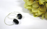 Classic black beaded hoop earrings with subtle swirls of gray. See them up close here https://wrist-flair.myshopify.com/collections/beaded-earrings/products/black-beaded-sterling-silver-hoop-earrings