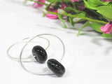 Do you love having staple and essential earrings you can rely on to look put together and stylish all year long? I do too! These sterling silver hoops features handmade glass beads in black with very subtle swirls of gray. See them up close by clicking here https://wrist-flair.myshopify.com/collections/beaded-earrings/products/black-beaded-sterling-silver-hoop-earrings