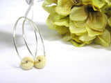cream colored glass beaded sterling silver hoop earrings for women--elegant and classy glass beaded jewelry that never goes out of style! See this pair up close by visiting https://wrist-flair.myshopify.com/collections/beaded-earrings/products/beige-beaded-sterling-silver-hoop-earrings