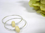 beige glass beaded sterling silver hoop earrings for women--Do you love having pieces of jewelry you can count on to match just about everything you wear? Count on these neutral colored earrings to be a staple and essential pair you will count on all year long! Click here https://wrist-flair.myshopify.com/collections/beaded-earrings/products/beige-beaded-sterling-silver-hoop-earrings