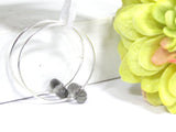 Gray Hoop Earrings--gorgeous in color and a great pair of earrings to rely on ALL year long! Grab your pair here https://wrist-flair.myshopify.com/collections/beaded-earrings/products/gray-beaded-silver-hoop-earrings