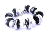 Do you love black and white and stripes all over? This zebra-inspired bracelet features handmade black and white glass beads and is a great way to add some unique class to your outfit! Makes for a great unique gift for women! See it up close by clicking here https://wrist-flair.myshopify.com/collections/statement-bracelets/products/black-and-white-zebra-toggle-bracelet