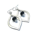 Modern Black Earrings--Do you love finding a modern pair of earrings in a neutral color you can rely on all year long? I do, too! Check out these silver teardrop earrings featuring black handmade glass beads https://wrist-flair.myshopify.com/collections/beaded-earrings/products/black-glass-beaded-silver-teardrop-earrings