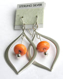 silver teardrop earrings with handmade coral orange glass beads! Modern by design and vibrant in color! If you're looking for trendy beaded jewelry for yourself or as a fun gift for ladies, shop the full selection at http://www.wristflairglass.com