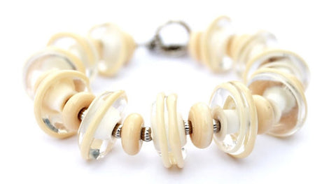 Off white glass beaded toggle bracelet--gorgeous, classy and makes a statement! See it up close by visiting https://wrist-flair.myshopify.com/collections/statement-bracelets/products/off-white-statement-bracelet
