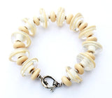 Cream Colored Bracelet--handmade glass beaded jewelry that is unique and boutique! See this bracelet up close by visiting https://wrist-flair.myshopify.com/collections/statement-bracelets/products/off-white-statement-bracelet